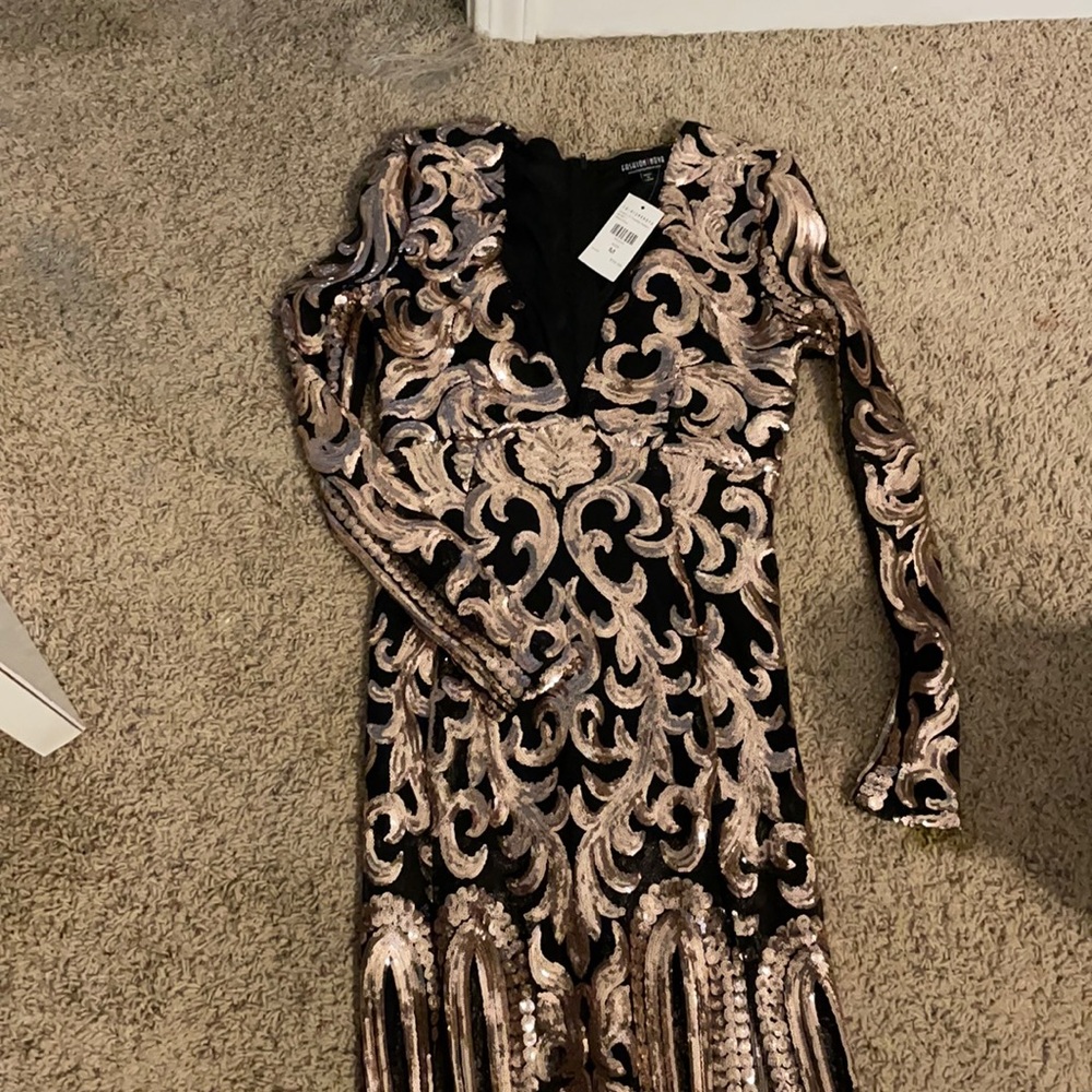 Black dress with beautiful Gold sequins. Running small size .